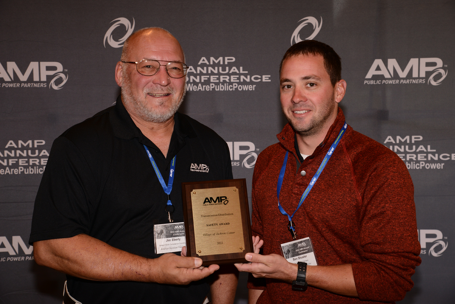 Jim Eberly, AMP OSHA/safety coordinator, presents Ben Shuster, Jackson Center Electric superintendent, with a 2022 AMP Safety Award.